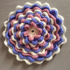 Crochet blooming flower cushion